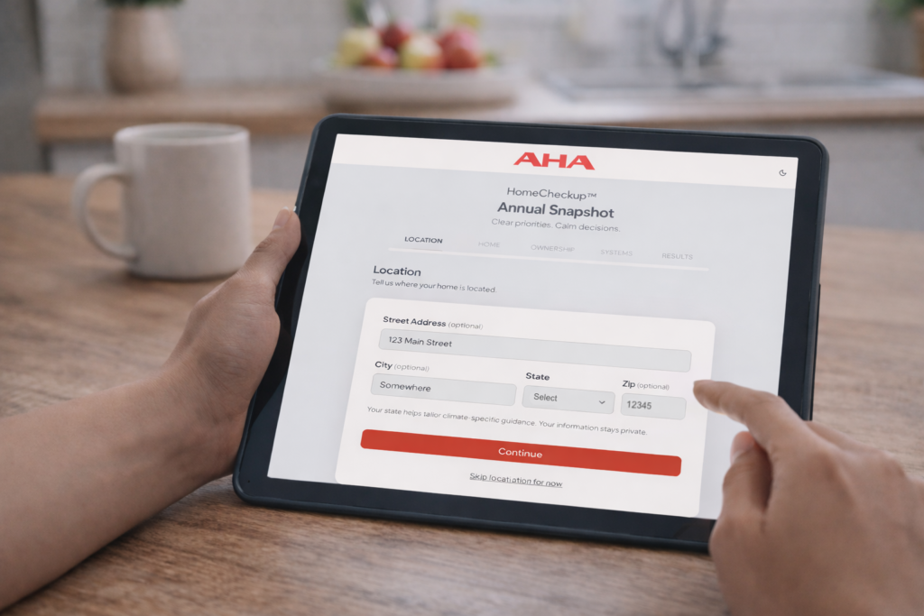 Homeowner at a kitchen table interacting with the HomeCheckup interface on their tablet.